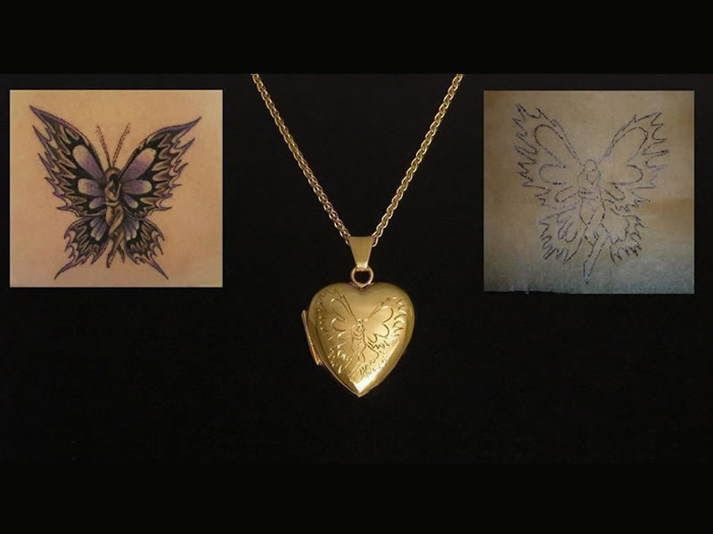 ADAPTED TATTOO DESIGN, ENGRAVED ON A 9CT GOLD LOCKET